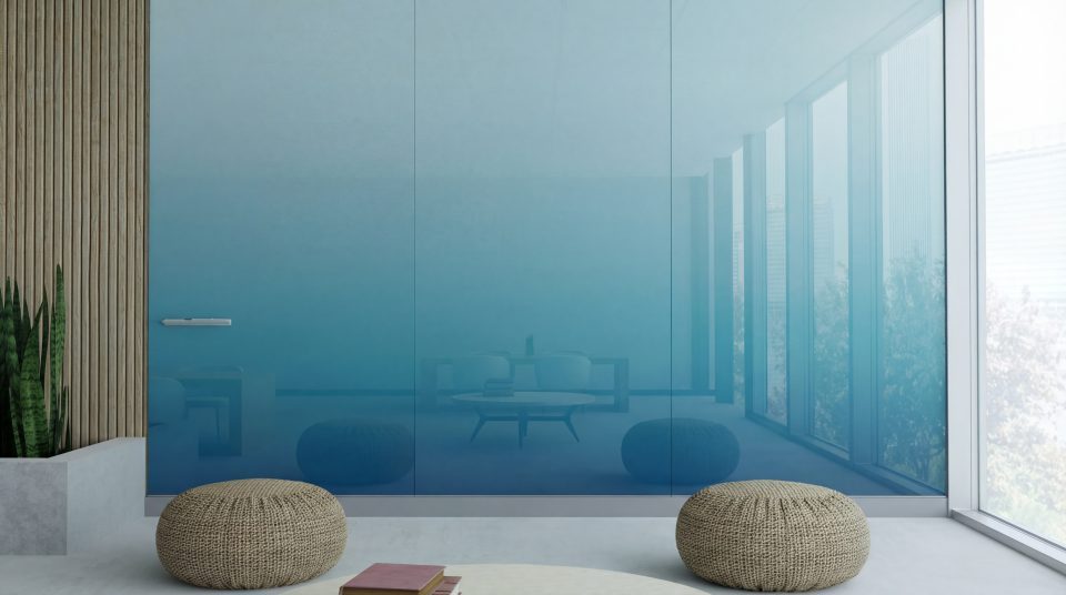 Floor-to-ceiling blue GlassWrite Linxx writable glass wall in a lounge space